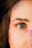 a close up of a woman's face with colored powder all over her face
