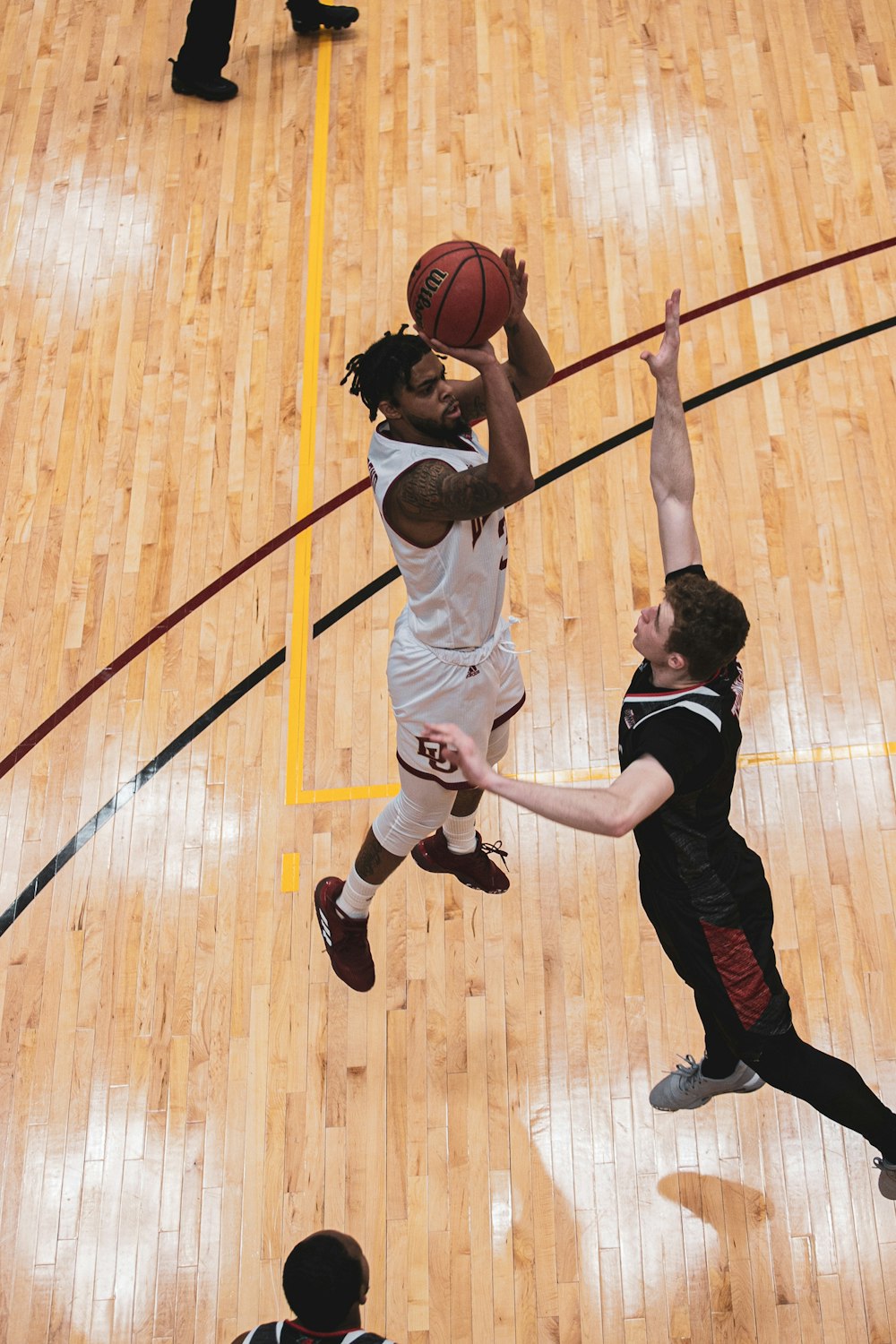 a basketball player jumping up to dunk the ball