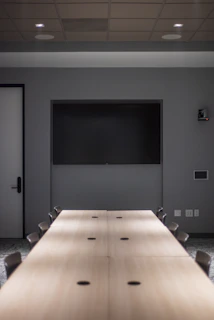 black flat screen tv on white wall