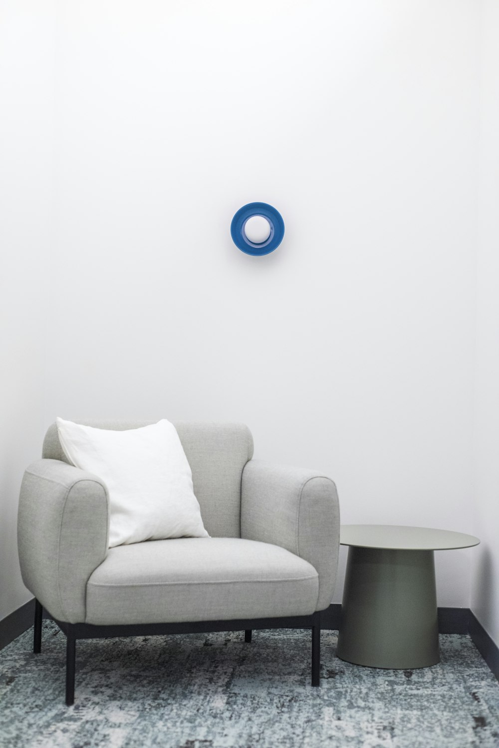 blue round ball on grey sofa