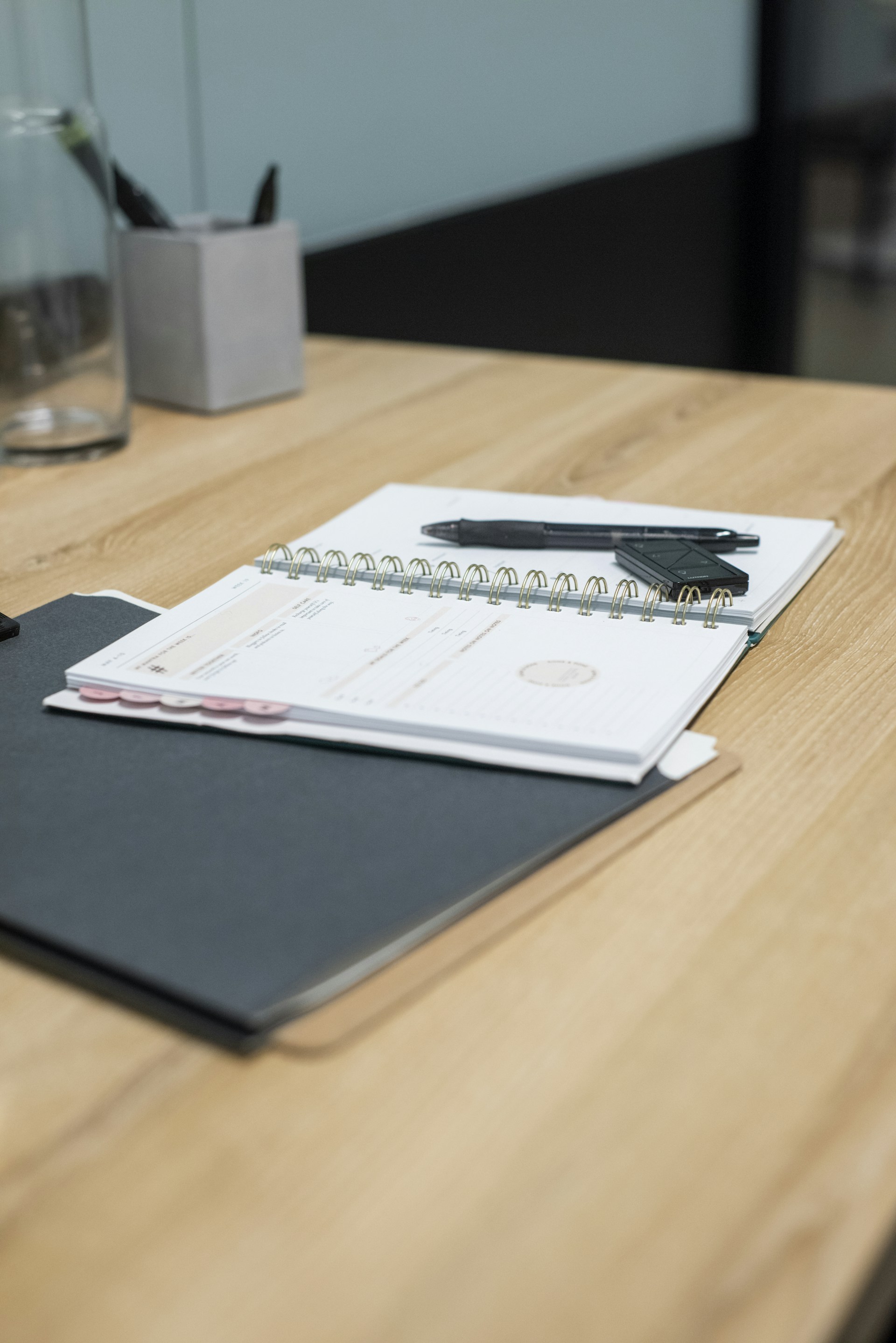 black ipad on brown wooden table