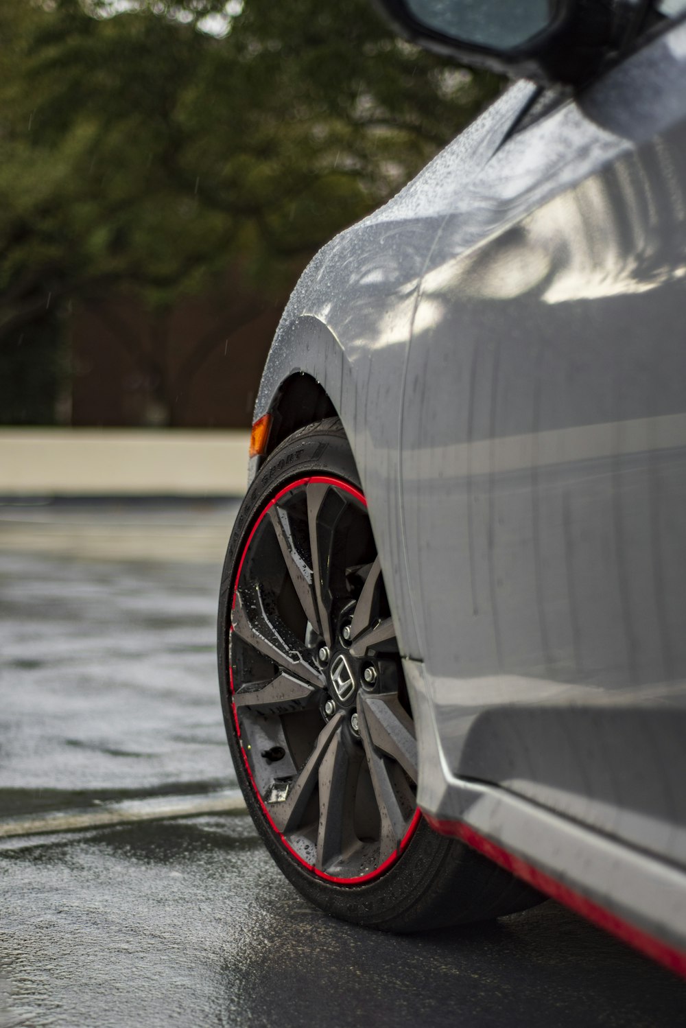 black and red wheel on gray asphalt road