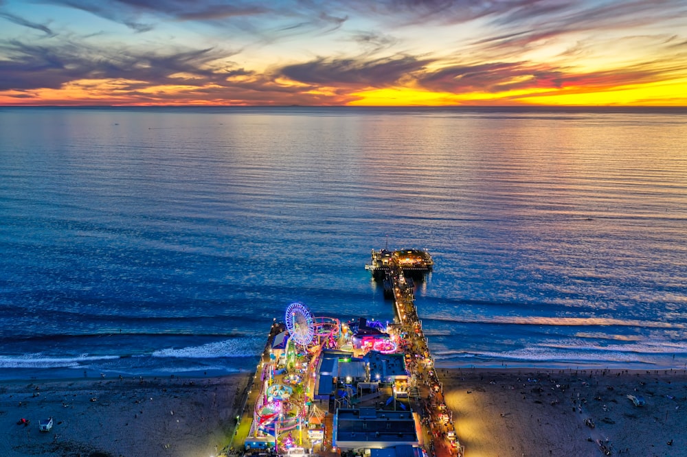 an aerial view of a carnival on the beach