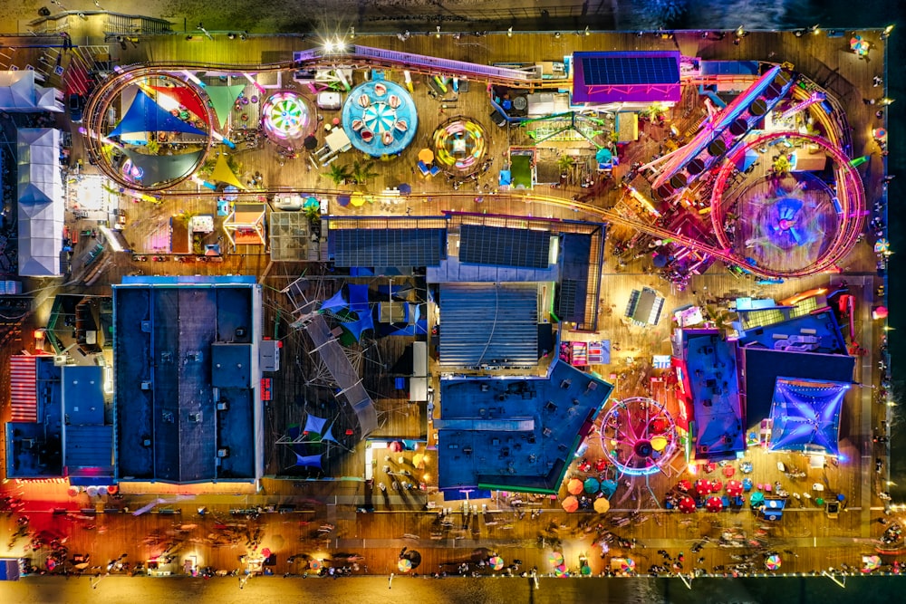 an aerial view of an amusement park at night