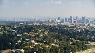 A panoramic view of a vibrant city skyline showcasing various types of residential buildings.