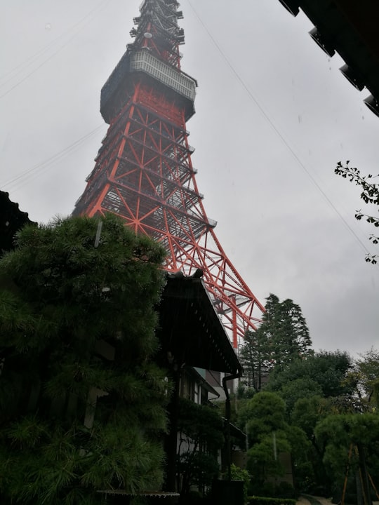 red and brown tower under white clouds in Tokyo Tower Japan