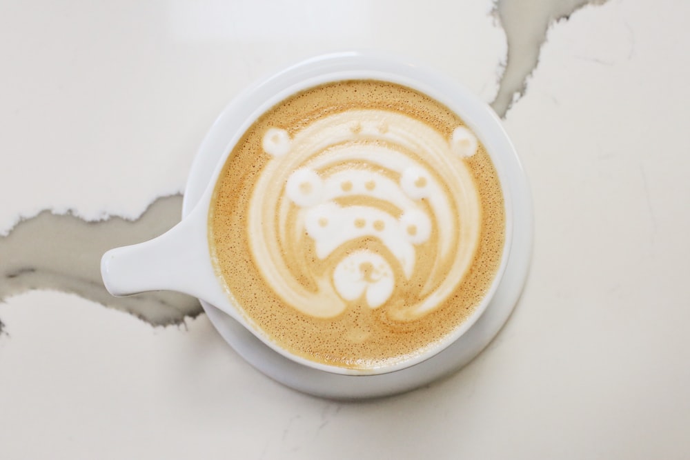 a cappuccino with a bear drawn on it