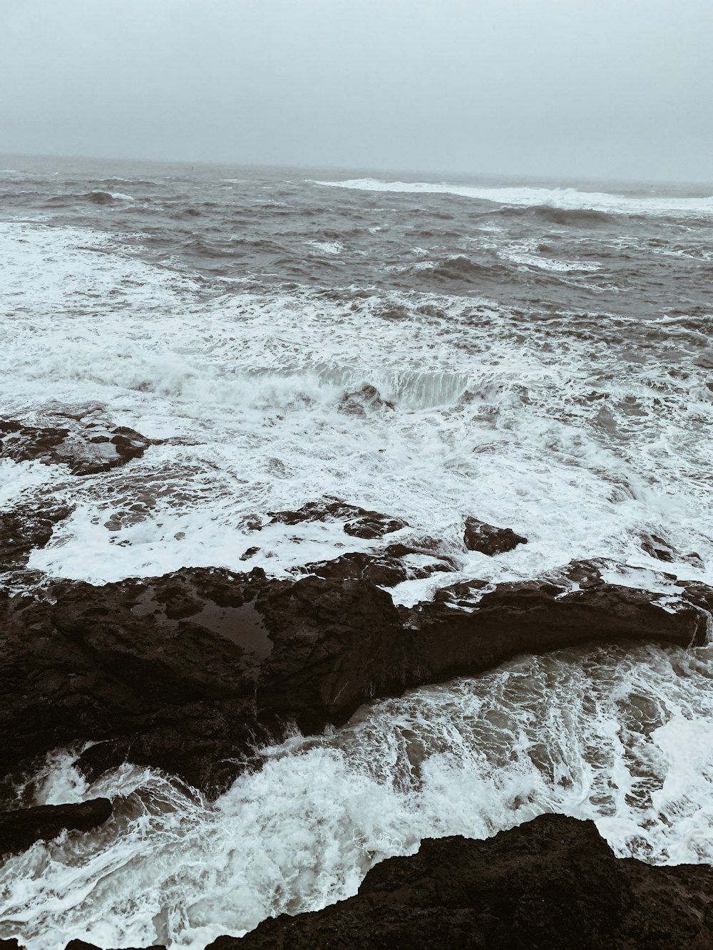 a black and white photo of the ocean