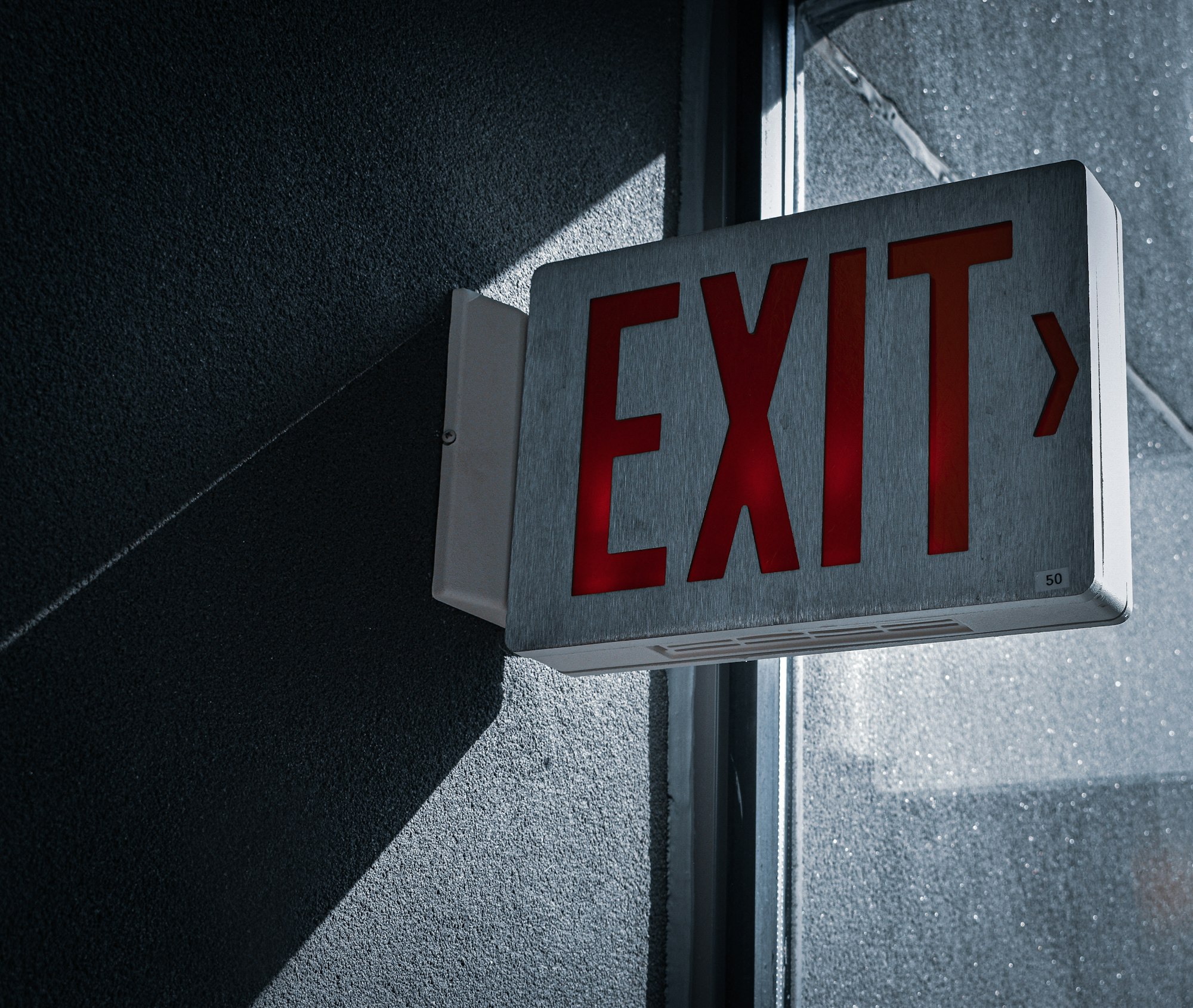 white and red exit sign