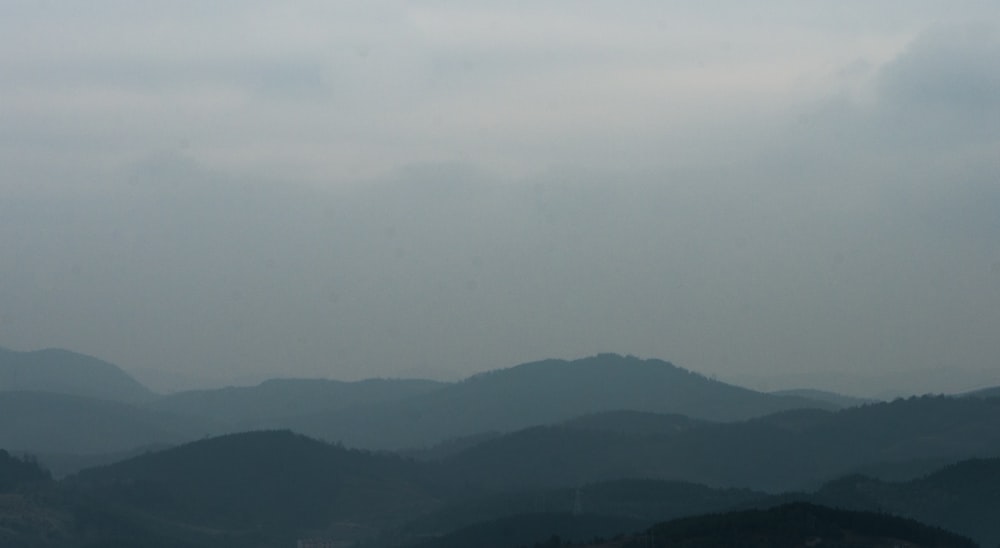 green mountains under white sky during daytime