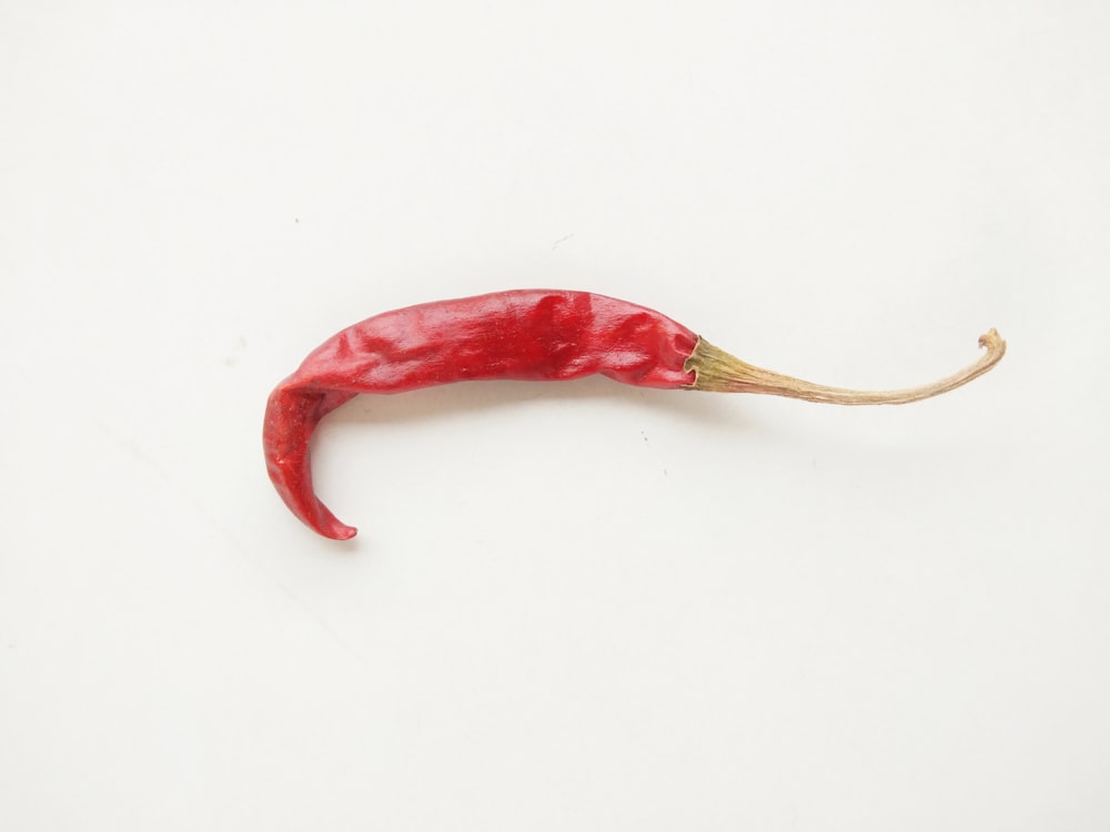 red chili on white surface