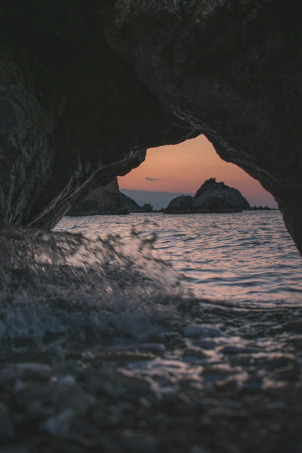 brown rock formation on sea during daytime