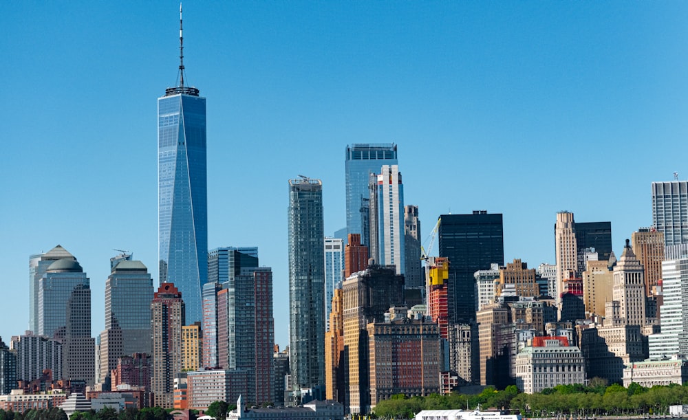 city skyline under blue sky during daytime