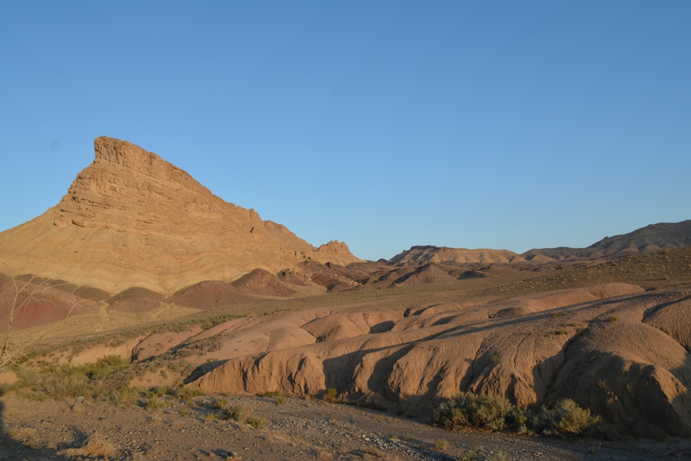 brown rock formation under blue sky during daytime