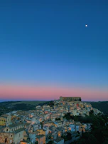 Illustration of a dreamy small town under soft pastel skies, reflecting Pasquiworld's charm.