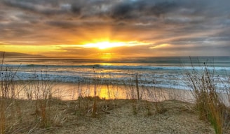A stunning sunrise captured over a serene beach.