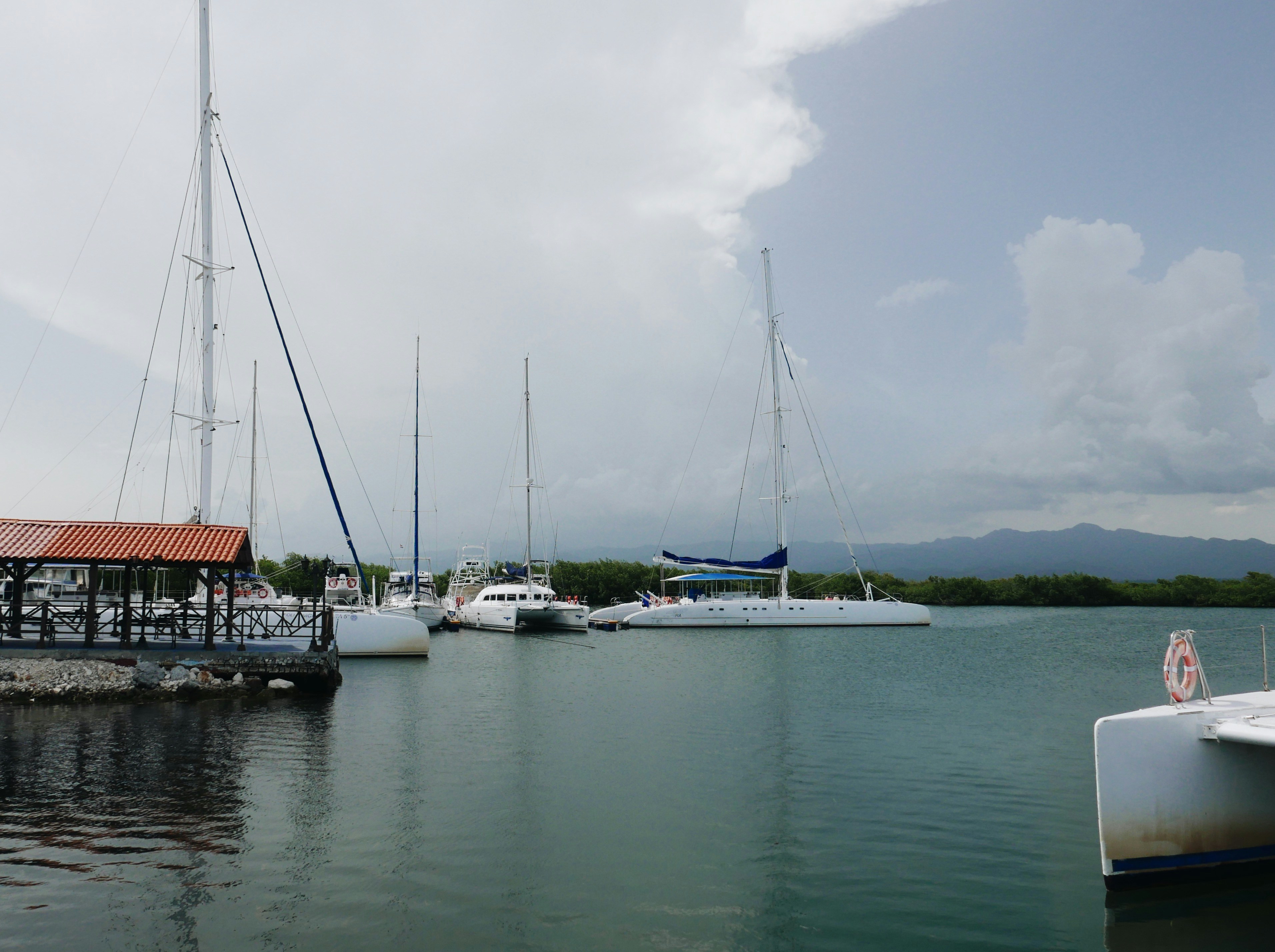 a group of boats that are sitting in the water, 