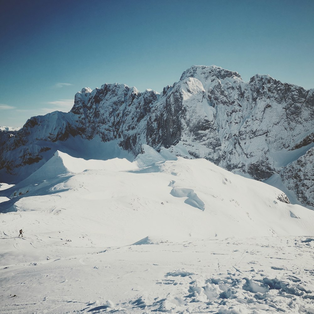 snow covered mountain under blue sky during daytime