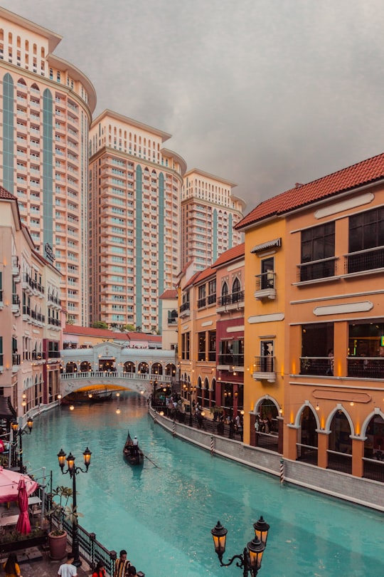 brown and white concrete building near body of water during daytime in Yellow Cab Pizza Co. Philippines