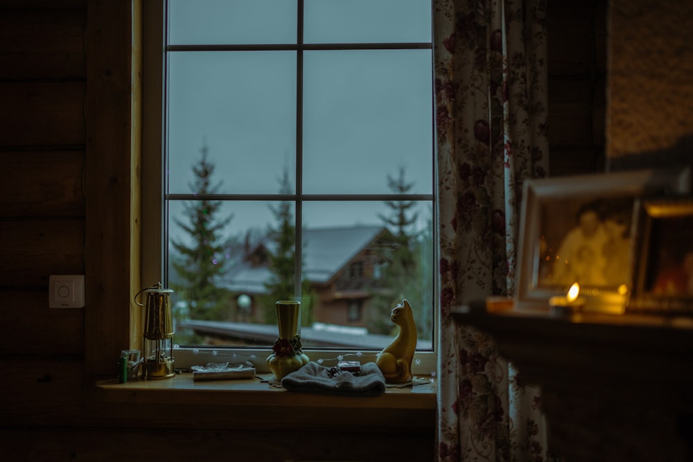 a window with a view of a snowy mountain