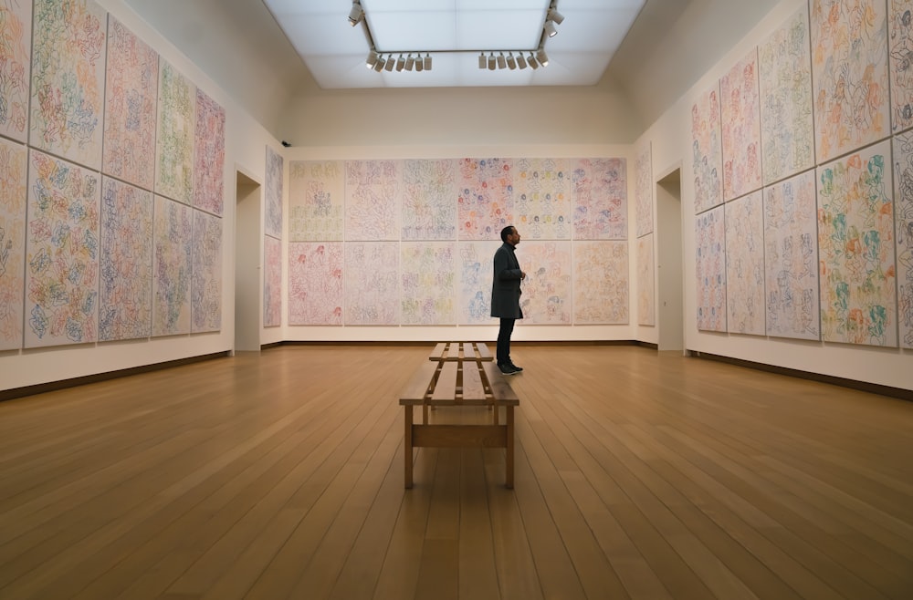 a person standing in a room with a bench