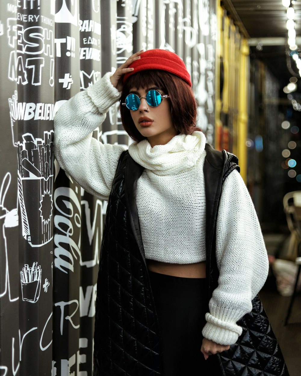 a mannequin wearing a red hat and sunglasses