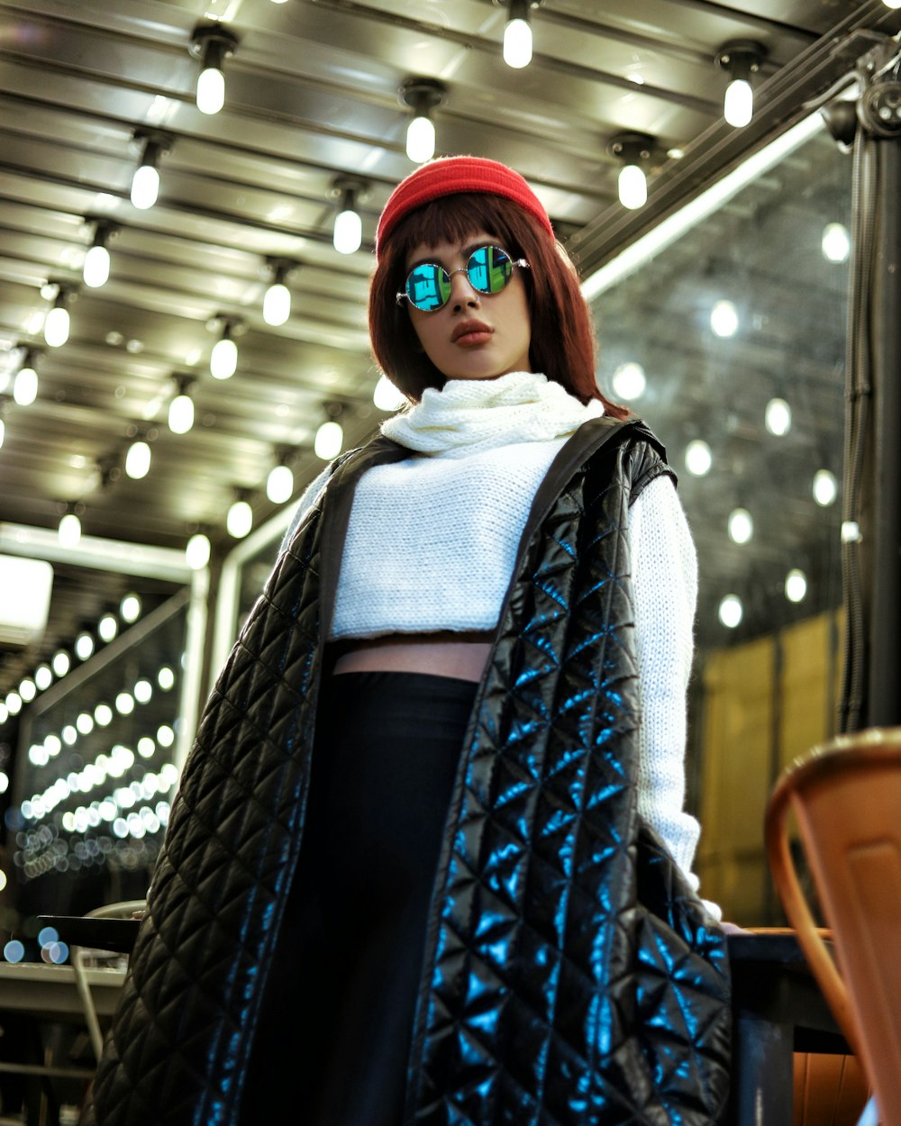 a woman wearing sunglasses and a black jacket