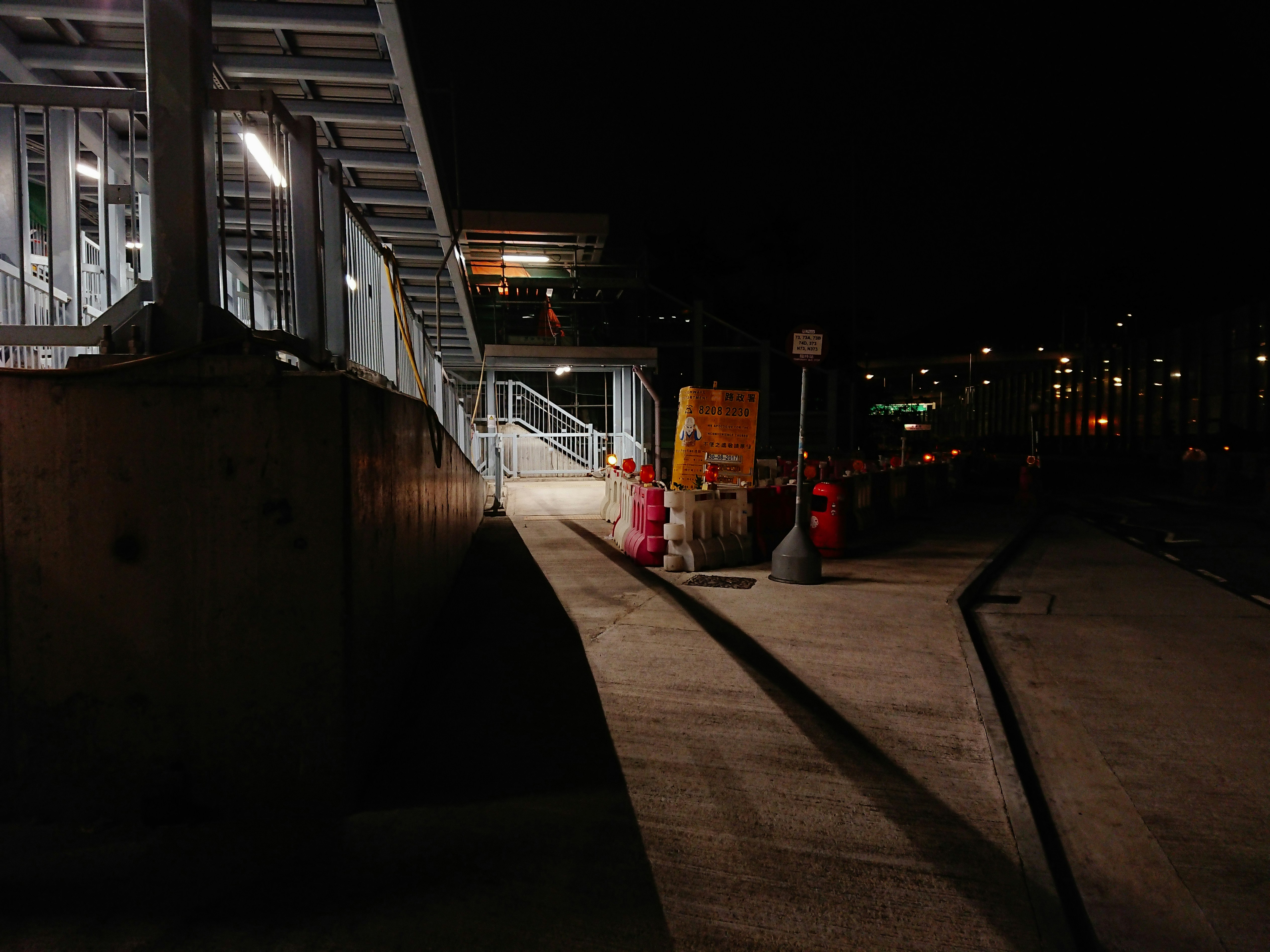 a red fire hydrant sitting on the side of a road