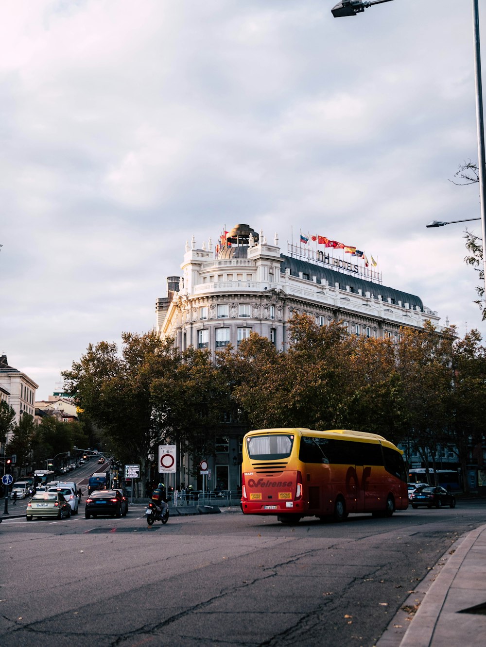 red and yellow bus on road during daytime