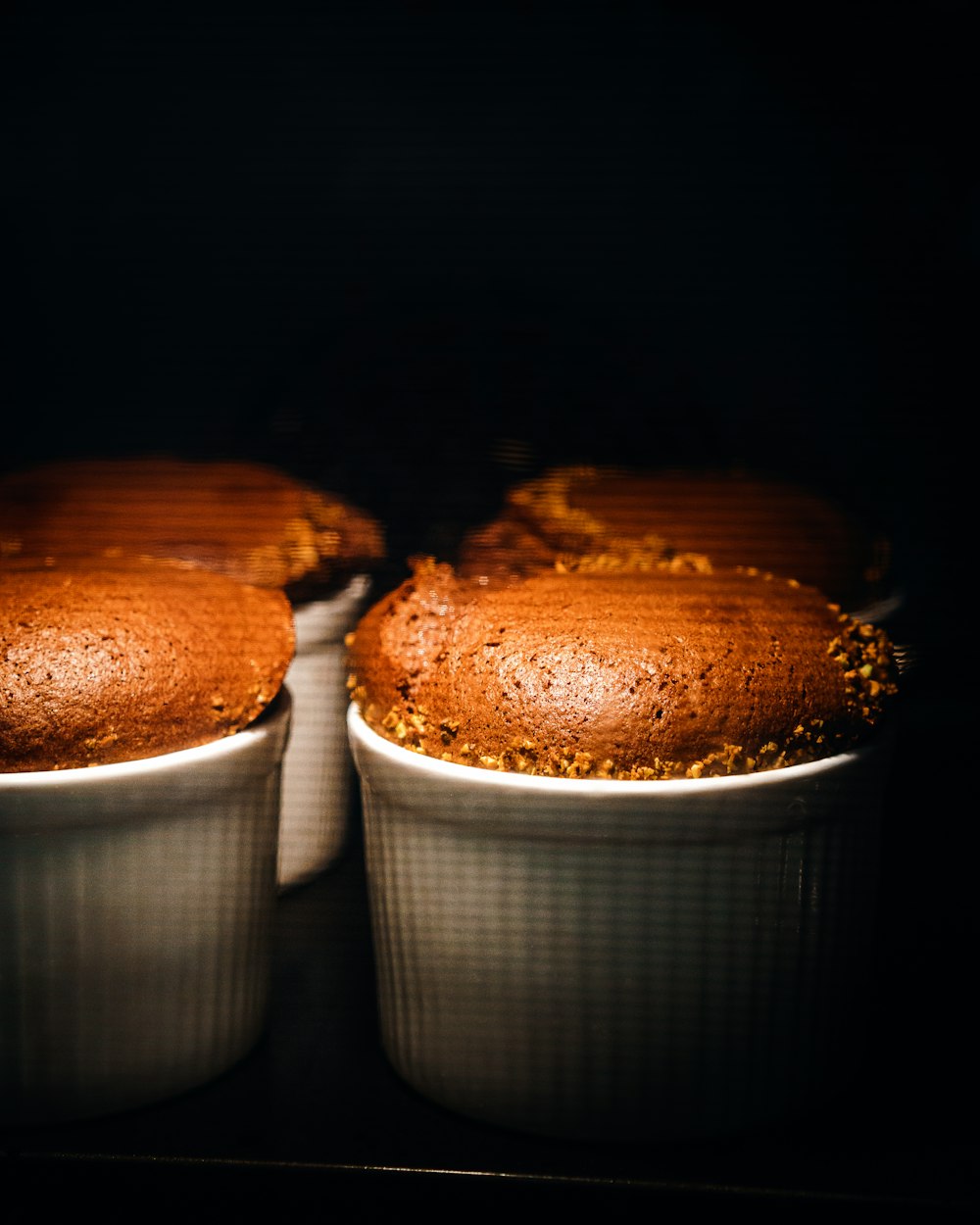 brown and white cupcakes on white ceramic cup