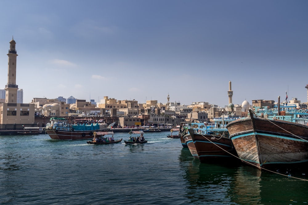 a group of boats floating on top of a body of water