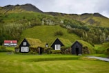 A picturesque view of a traditional Icelandic turf house.