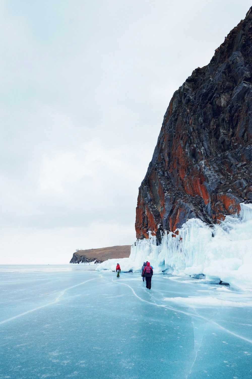 people on ice covered ground during daytime