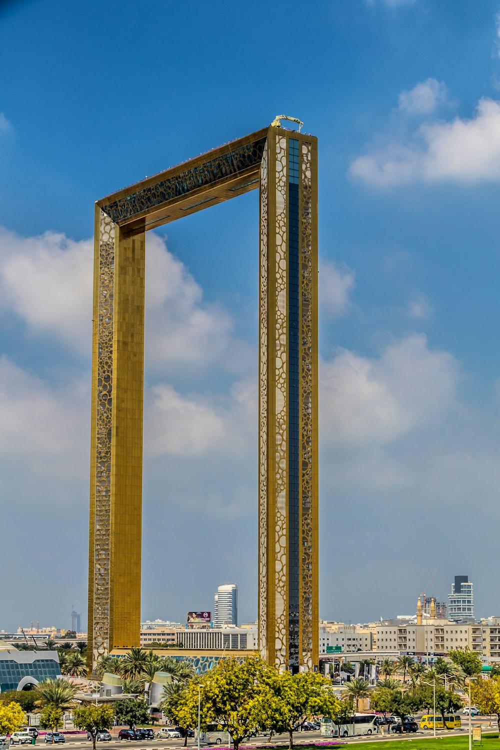 a tall clock tower sitting in the middle of a park