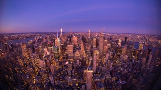An aerial view of a bustling city financial district at sunset, symbolizing vibrant economic opportunity.