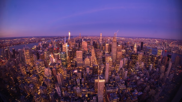 An aerial view of a bustling city financial district at sunset, symbolizing vibrant economic opportunity.