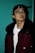 man in black and red jacket wearing black framed eyeglasses