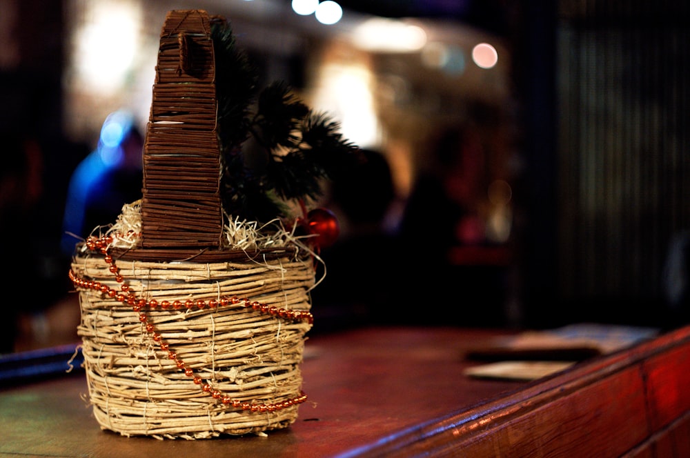 brown woven basket on brown wooden table