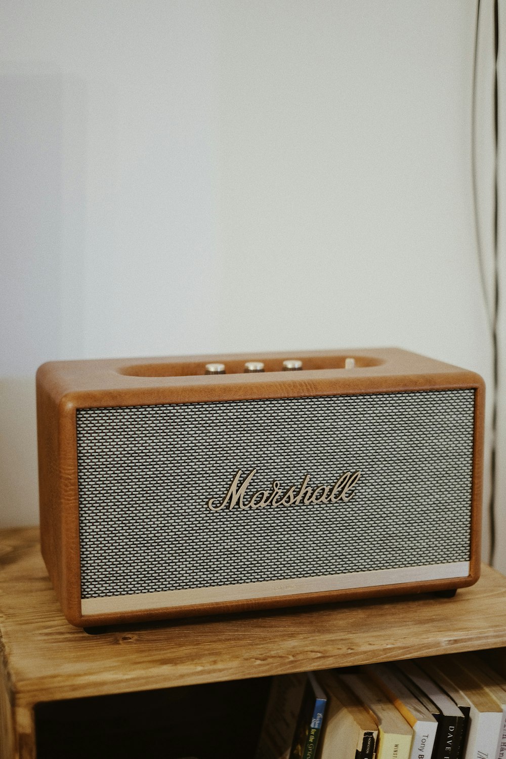 a radio sitting on top of a wooden shelf