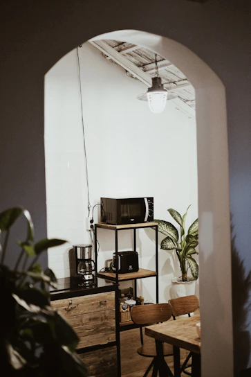 Cozy kitchen corner featuring a velora anti-fatigue mat beneath a rustic wooden table.