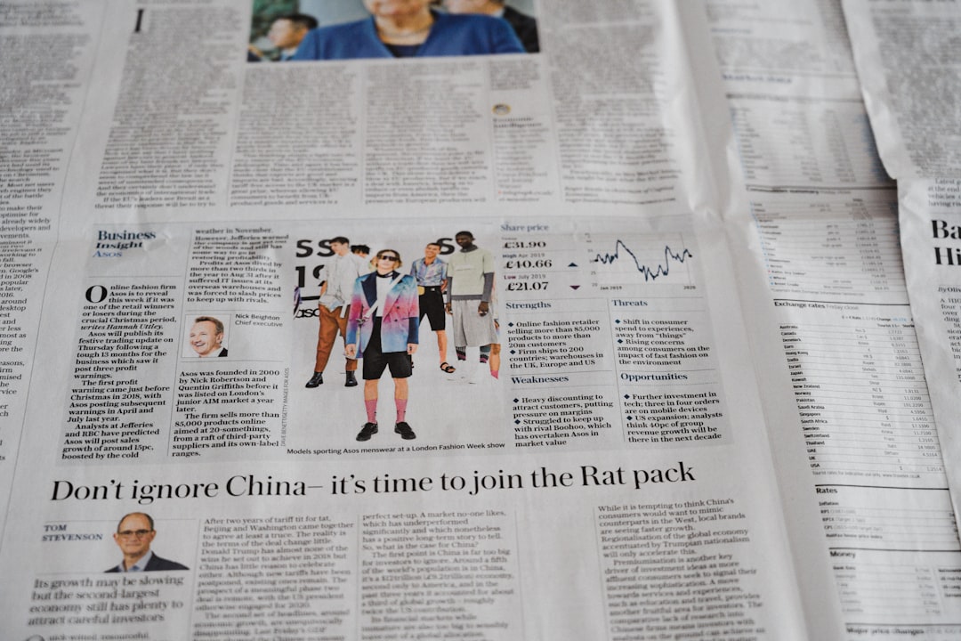 a newspaper with a picture of a man on it, Business section of a newspaper
