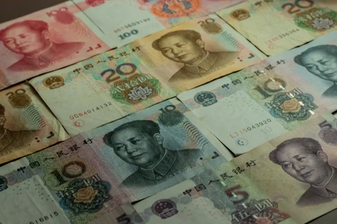 a table topped with lots of different bills