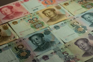 a table topped with lots of different bills