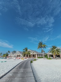 white and brown beach umbrellas on beach during daytime