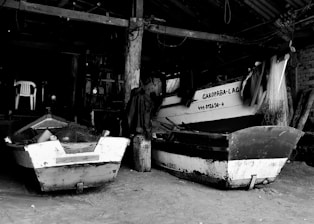 Inside view of a clean, secure indoor boat storage facility with boats neatly arranged and protected.