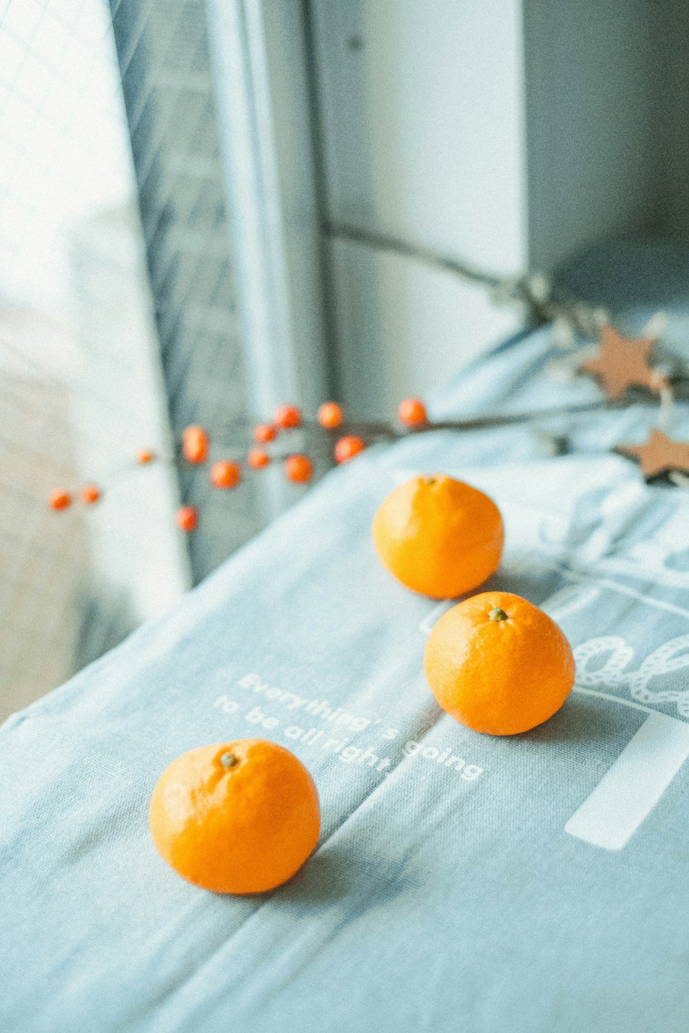 orange fruit on white textile