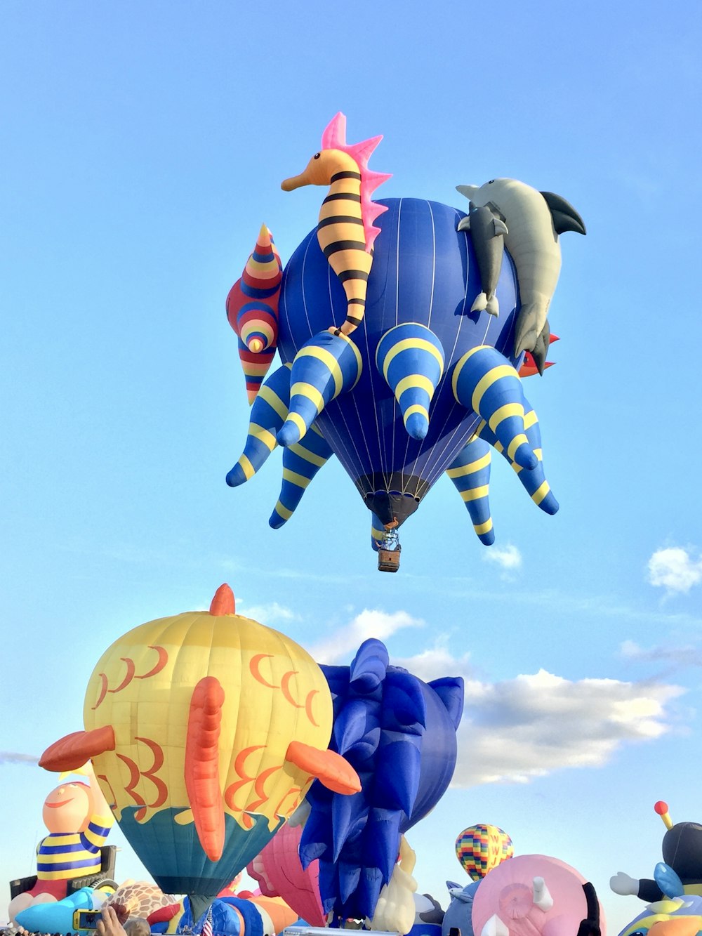 red blue and yellow hot air balloon flying during daytime