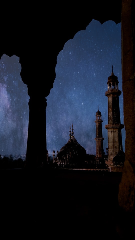 black and white concrete building in Bara Imambara India