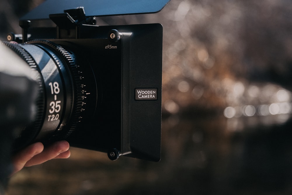 a person holding a camera in their hand