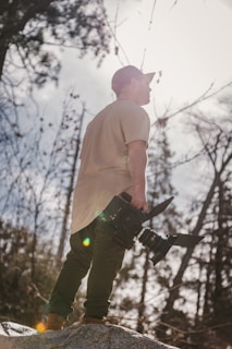 A photographer adjusting filters on a matte box during a golden hour shoot outdoors